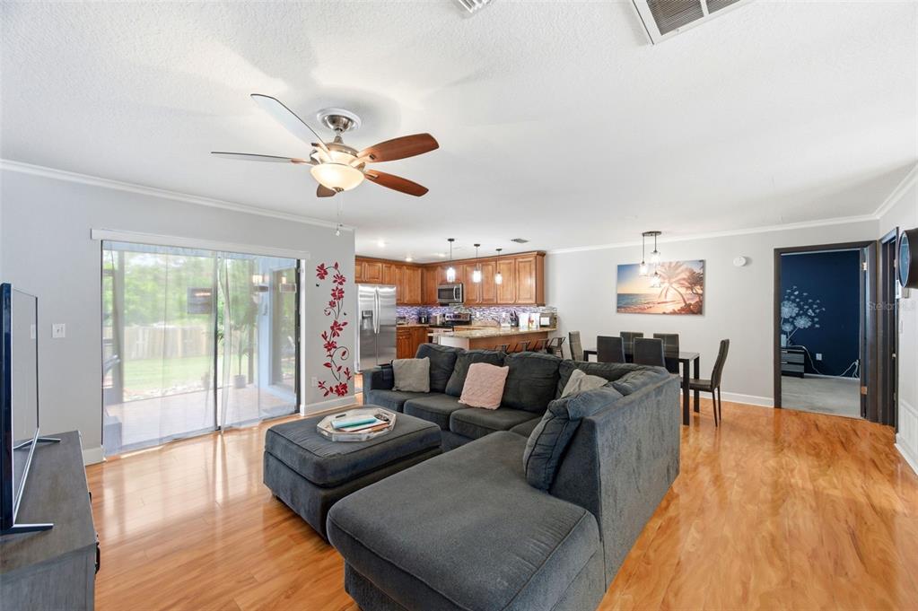 2816 Rustic Oaks Drive Palm Harbor, FL 34684 - Photo 13 of 70 a living room with furniture and a large window