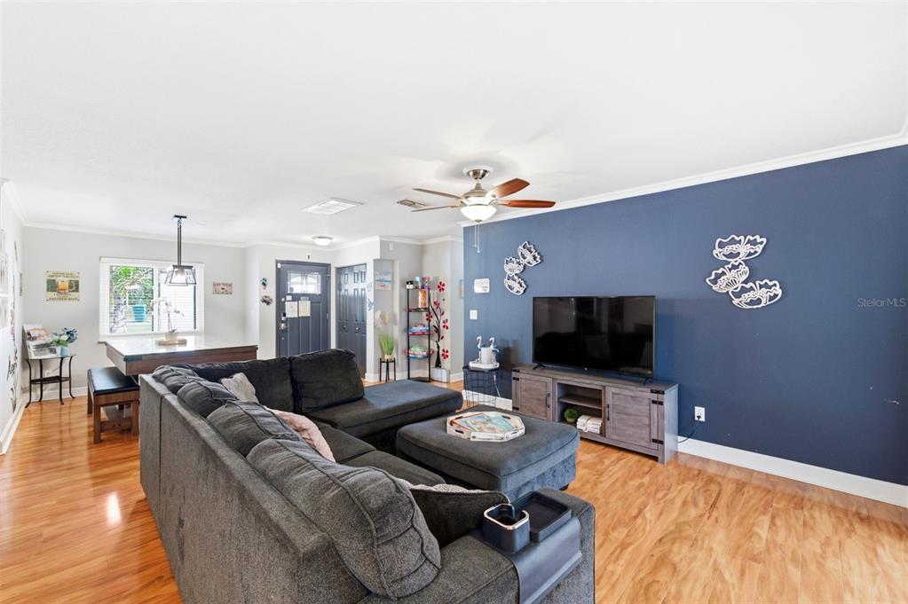 2816 Rustic Oaks Drive Palm Harbor, FL 34684 - Photo 15 of 70 a living room with furniture and a flat screen tv