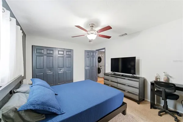 a bedroom with a bed and a window