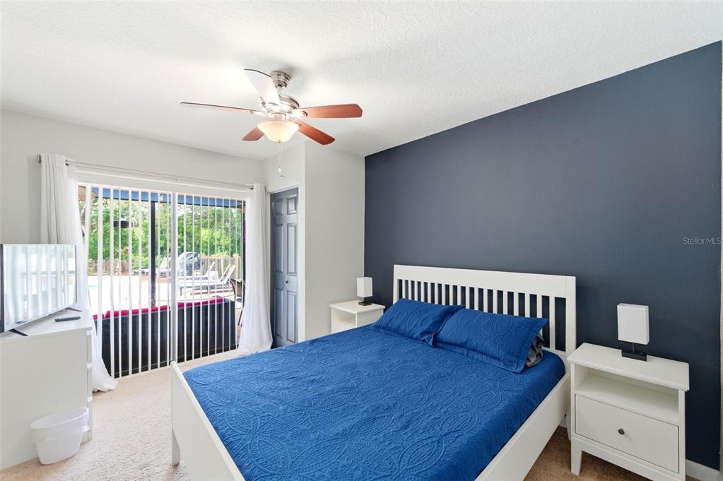 2816 Rustic Oaks Drive Palm Harbor, FL 34684 - Photo 31 of 70 a bedroom with bed and wooden floor
