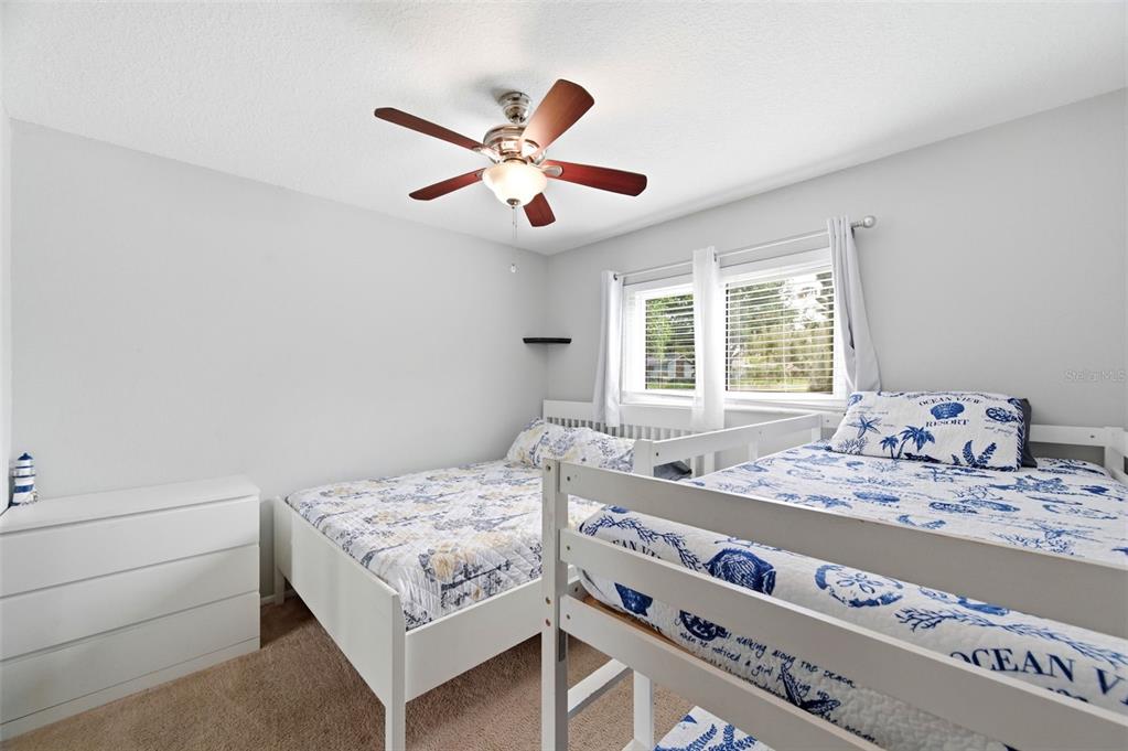 2816 Rustic Oaks Drive Palm Harbor, FL 34684 - Photo 38 of 70 a bedroom with a bed and a window