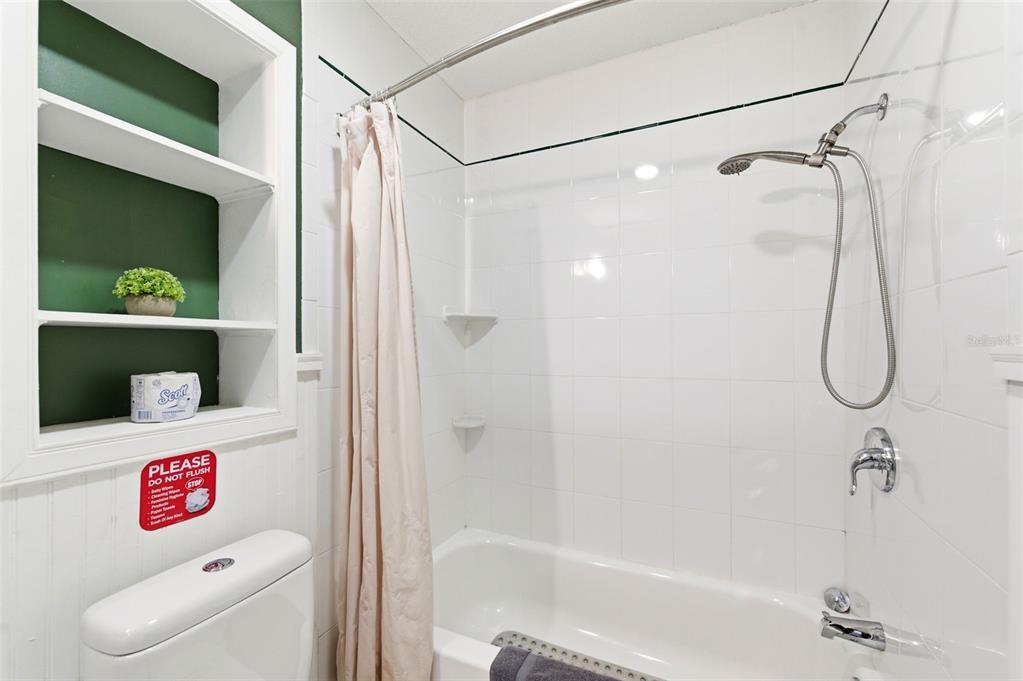 2816 Rustic Oaks Drive Palm Harbor, FL 34684 - Photo 41 of 70 a bathroom with a shower and a toilet