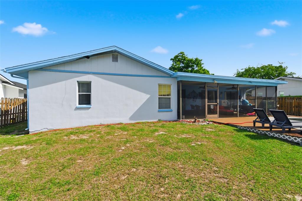 2816 Rustic Oaks Drive Palm Harbor, FL 34684 - Photo 51 of 70 a view of a house with backyard sitting area and garden