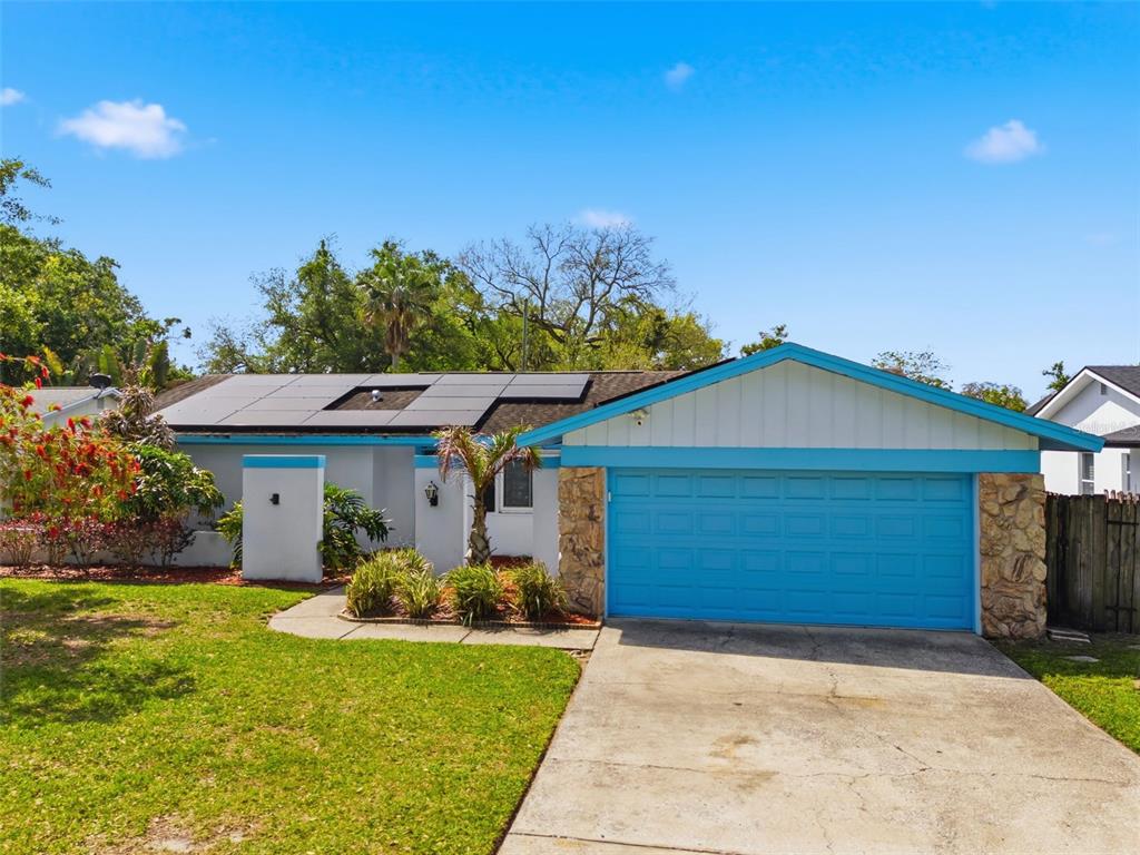 2816 Rustic Oaks Drive Palm Harbor, FL 34684 - Photo 56 of 70 a front view of a house with a yard