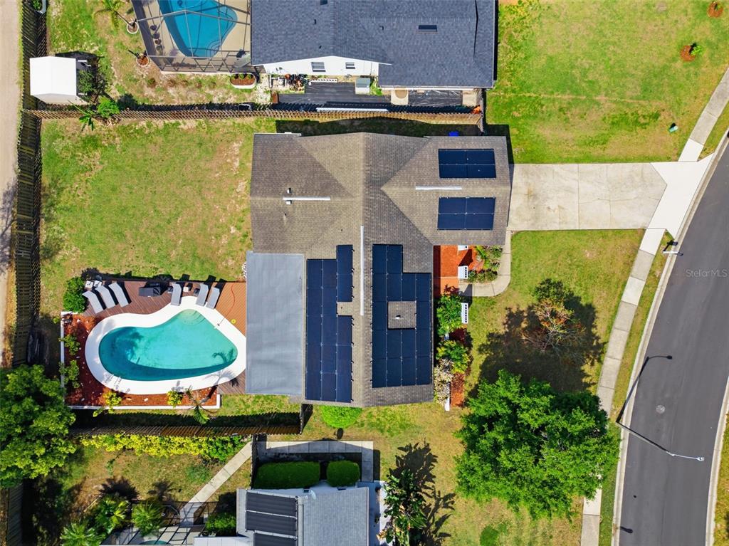 2816 Rustic Oaks Drive Palm Harbor, FL 34684 - Photo 62 of 70 an aerial view of a house with garden space and outdoor seating