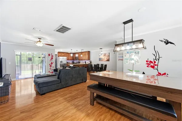 a view of a dining room with furniture window and wooden floor