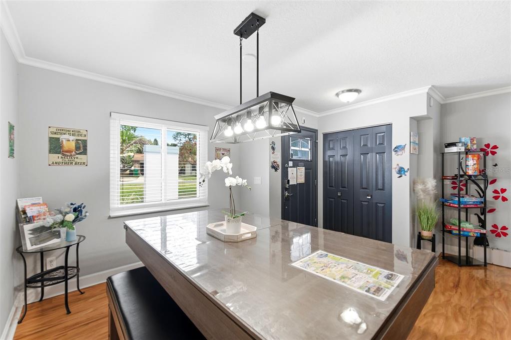 2816 Rustic Oaks Drive Palm Harbor, FL 34684 - Photo 10 of 70 a view of a dining room with furniture window and wooden floor