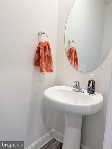 a bathroom with a sink and mirror