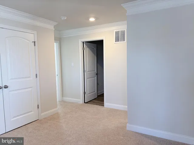 an empty room with closet area