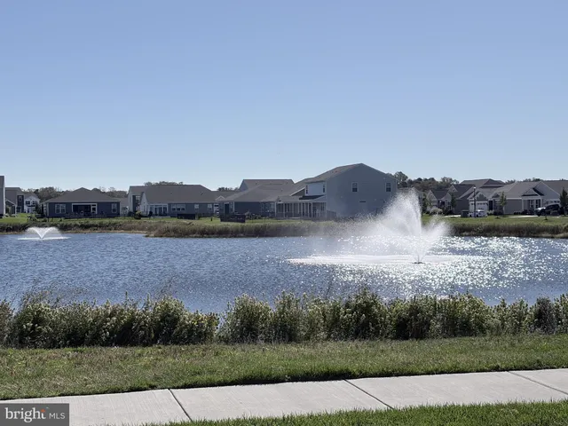 an aerial view of a house with lake view