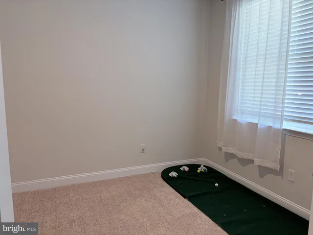 a bathroom with a granite countertop sink and vanity