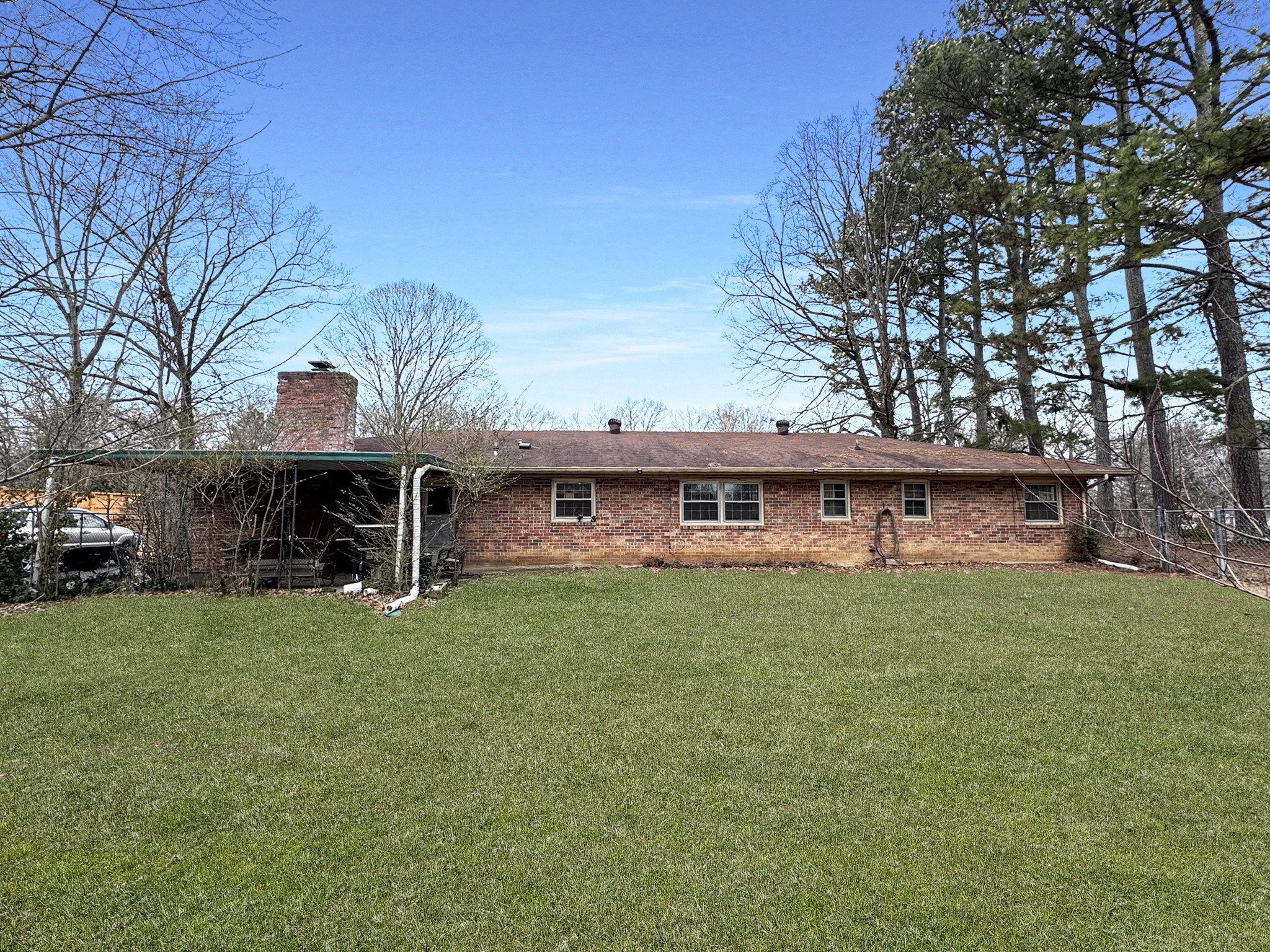 1308 Royal Trail Manchester, TN 37355 - Photo 17 of 18 a view of a house with a backyard and a tree