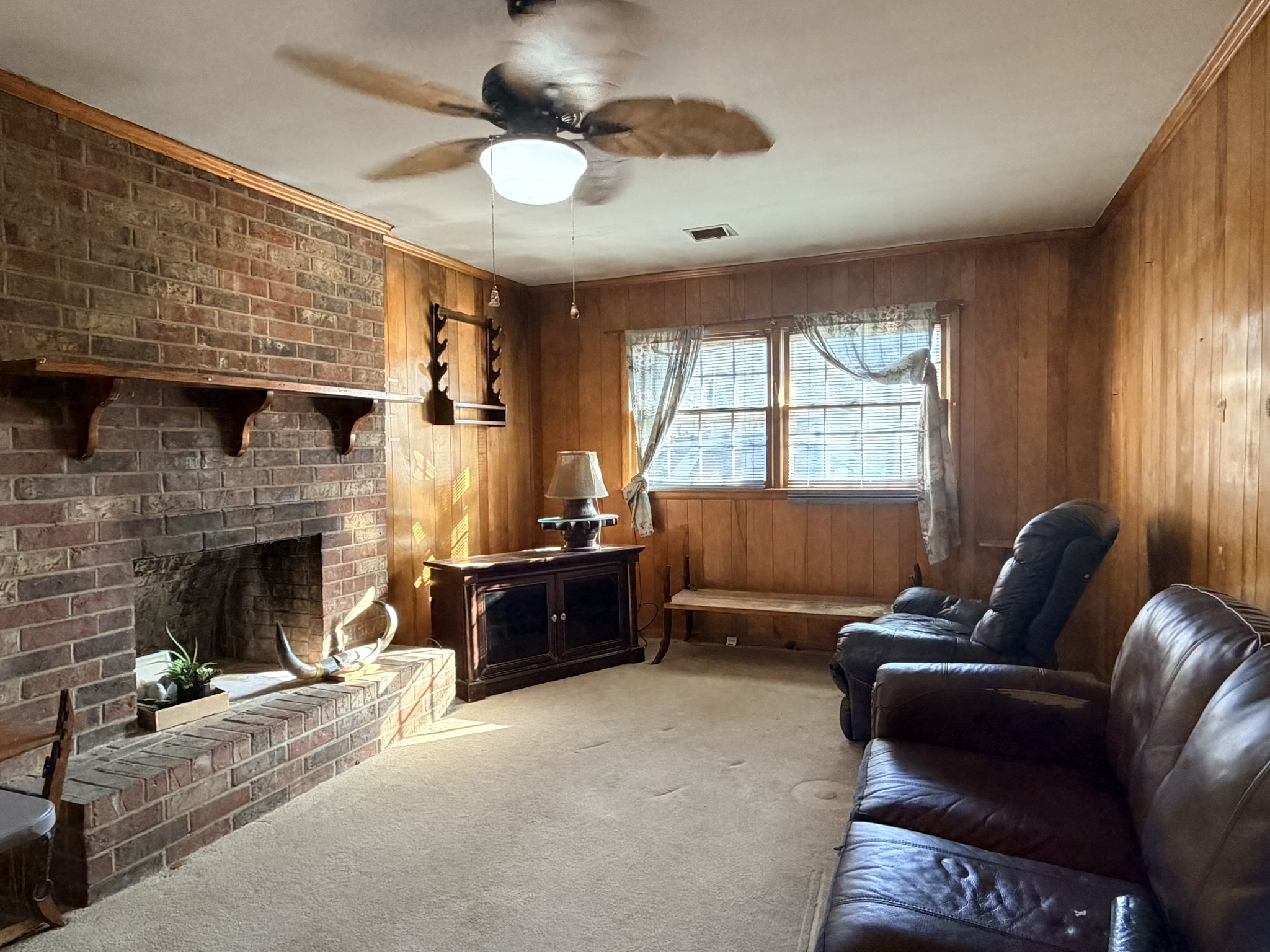 1308 Royal Trail Manchester, TN 37355 - Photo 4 of 18 a living room with furniture a fireplace and a large window