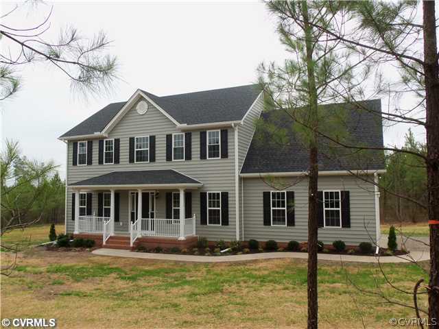 10 Earl Road Goochland, VA 23063 - Photo 1 of 17 a front view of a house with garden and swimming pool