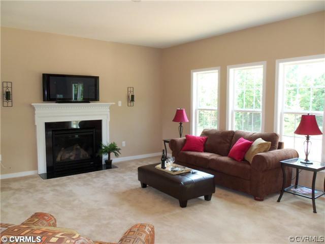 10 Earl Road Goochland, VA 23063 - Photo 5 of 17 a living room with furniture a flat screen tv and a fireplace