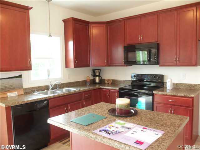 10 Earl Road Goochland, VA 23063 - Photo 8 of 17 a kitchen with a sink stove top oven and cabinets