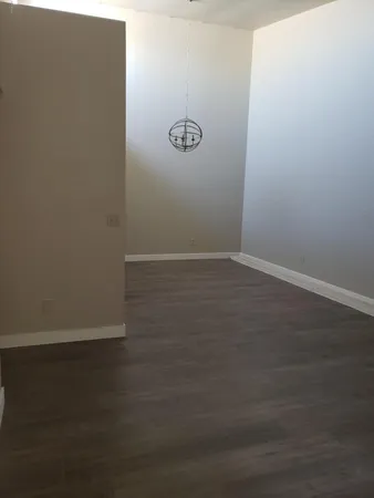a kitchen with a refrigerator and a sink