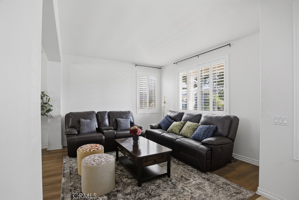 6865 Hop Clover Road Eastvale, CA 92880 - Photo 11 of 59 a living room with furniture and a window