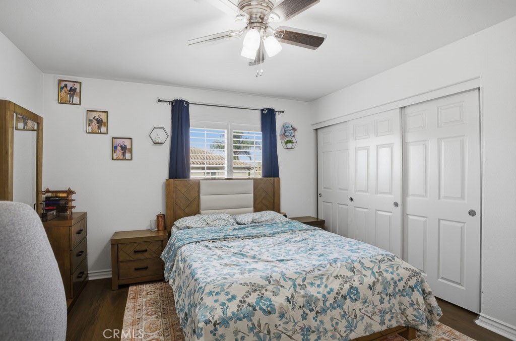 6865 Hop Clover Road Eastvale, CA 92880 - Photo 41 of 59 a bedroom with a bed and a chandelier