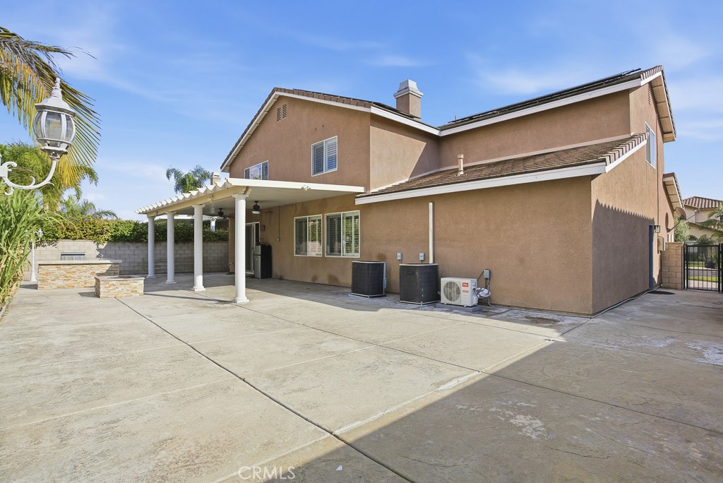 6865 Hop Clover Road Eastvale, CA 92880 - Photo 52 of 59 a view of a house with a patio