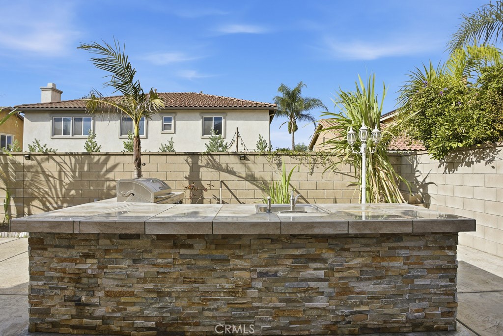 6865 Hop Clover Road Eastvale, CA 92880 - Photo 54 of 59 a view of a house with a swimming pool