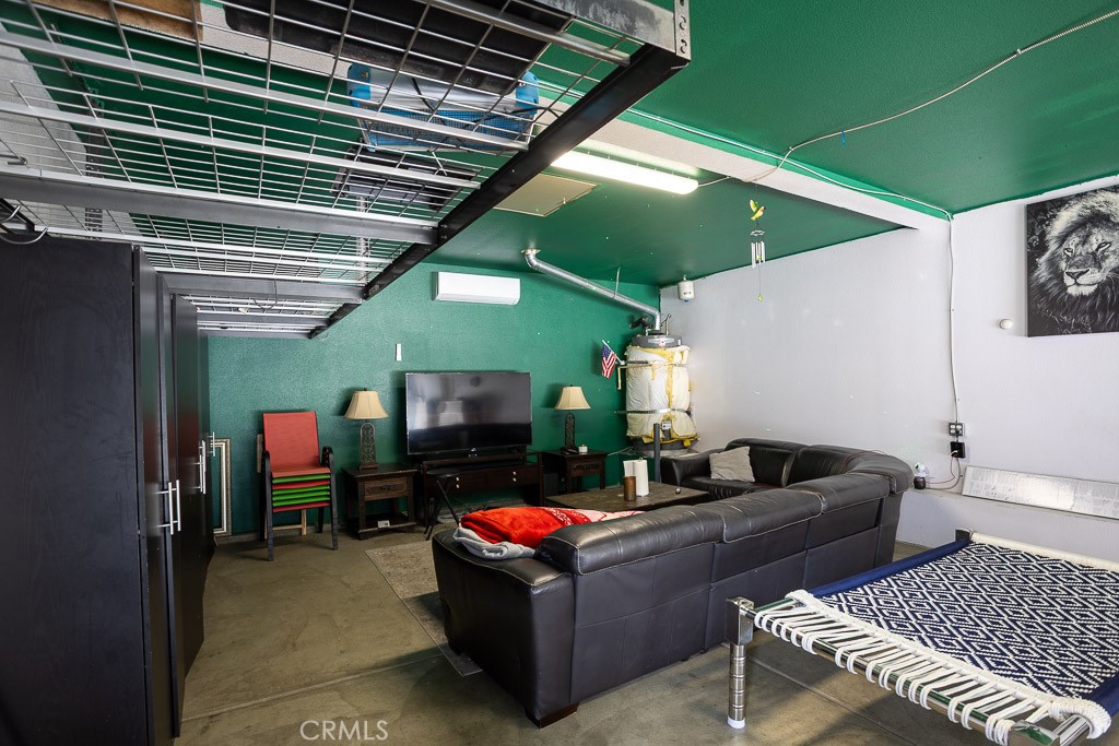 6865 Hop Clover Road Eastvale, CA 92880 - Photo 56 of 59 a living room with furniture and a wooden floor