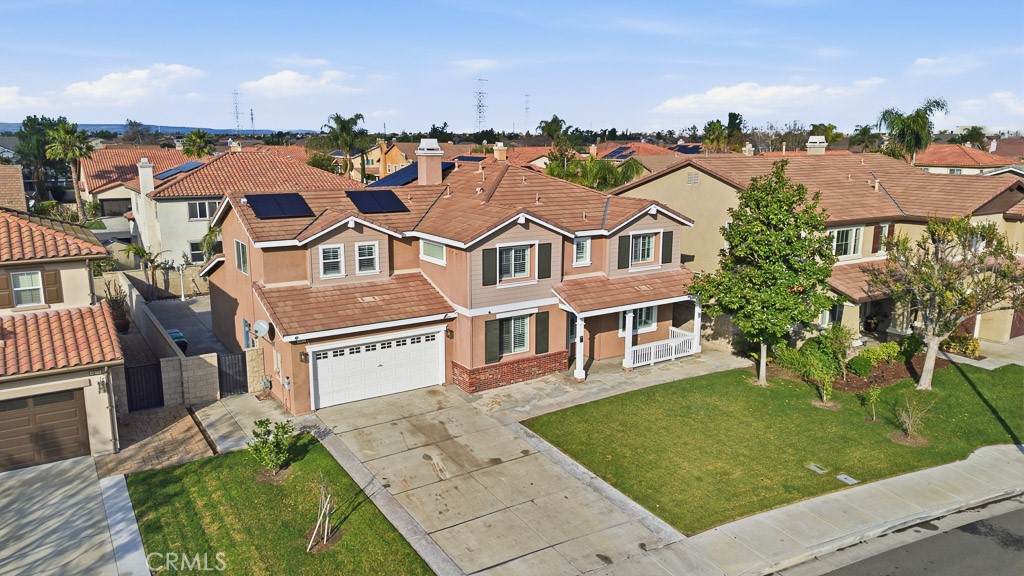 6865 Hop Clover Road Eastvale, CA 92880 - Photo 58 of 59 an aerial view of residential houses with outdoor space and trees