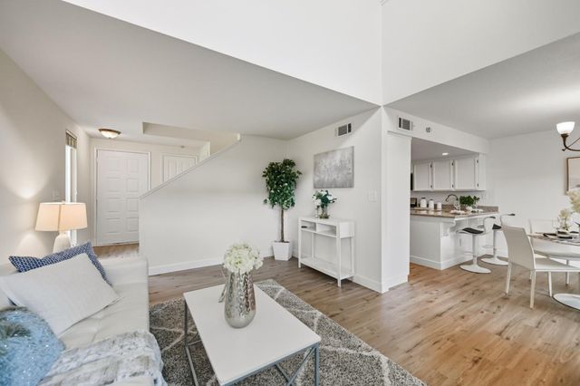a living room with furniture and a table
