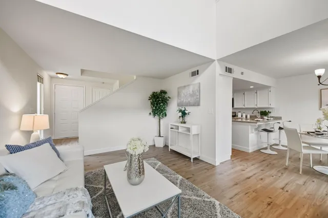 a living room with furniture and a table