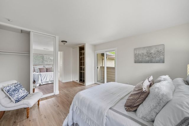 a bedroom with a bed and a couch