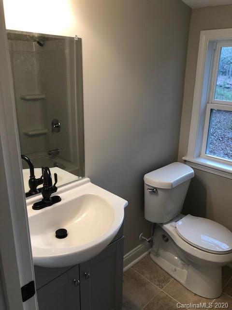 3269 Camp Creek Road Lancaster, SC 29720 - Photo 8 of 11 a bathroom with a sink toilet and a mirror