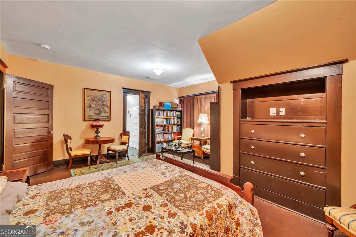 212 East Union Street Vienna, GA 31092 - Photo 38 of 62 a bed room with a bed and a dresser