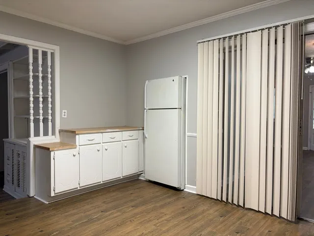a view of a kitchen with wooden floor