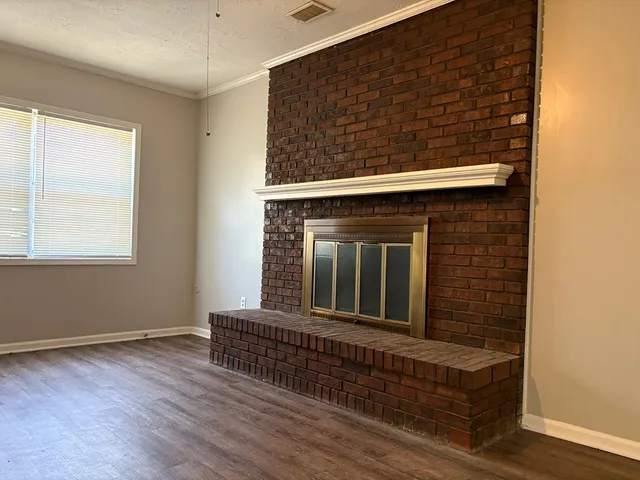 a view of a livingroom with wooden floor