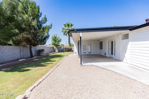 a view of a backyard with a patio
