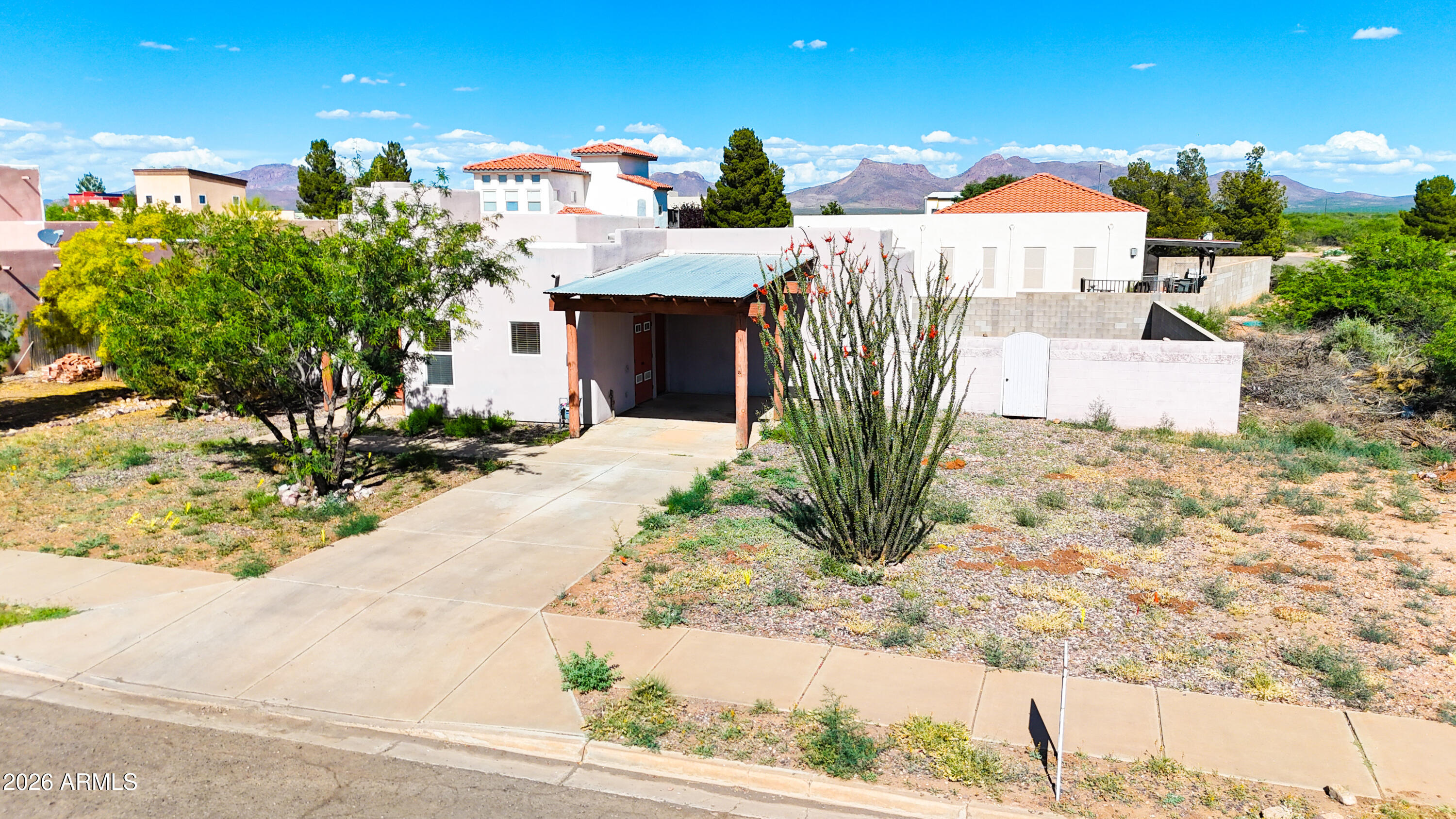 4105 North Washington Avenue Douglas, AZ 85607 - Photo 32 of 61 a view of a house with a yard and sitting area