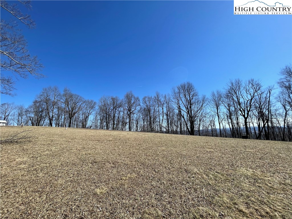 Tbd Lot #4 Tbd Ridge Lansing, NC 28643 - Photo 12 of 23 a view of dirt field with trees in the background