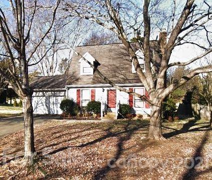 9800 Fairway Ridge Road Charlotte, NC 28277 - Photo 1 of 2 a front view of a house with a yard covered in snow
