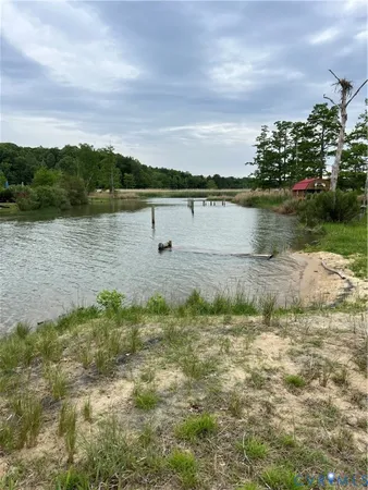 a view of a lake with a yard