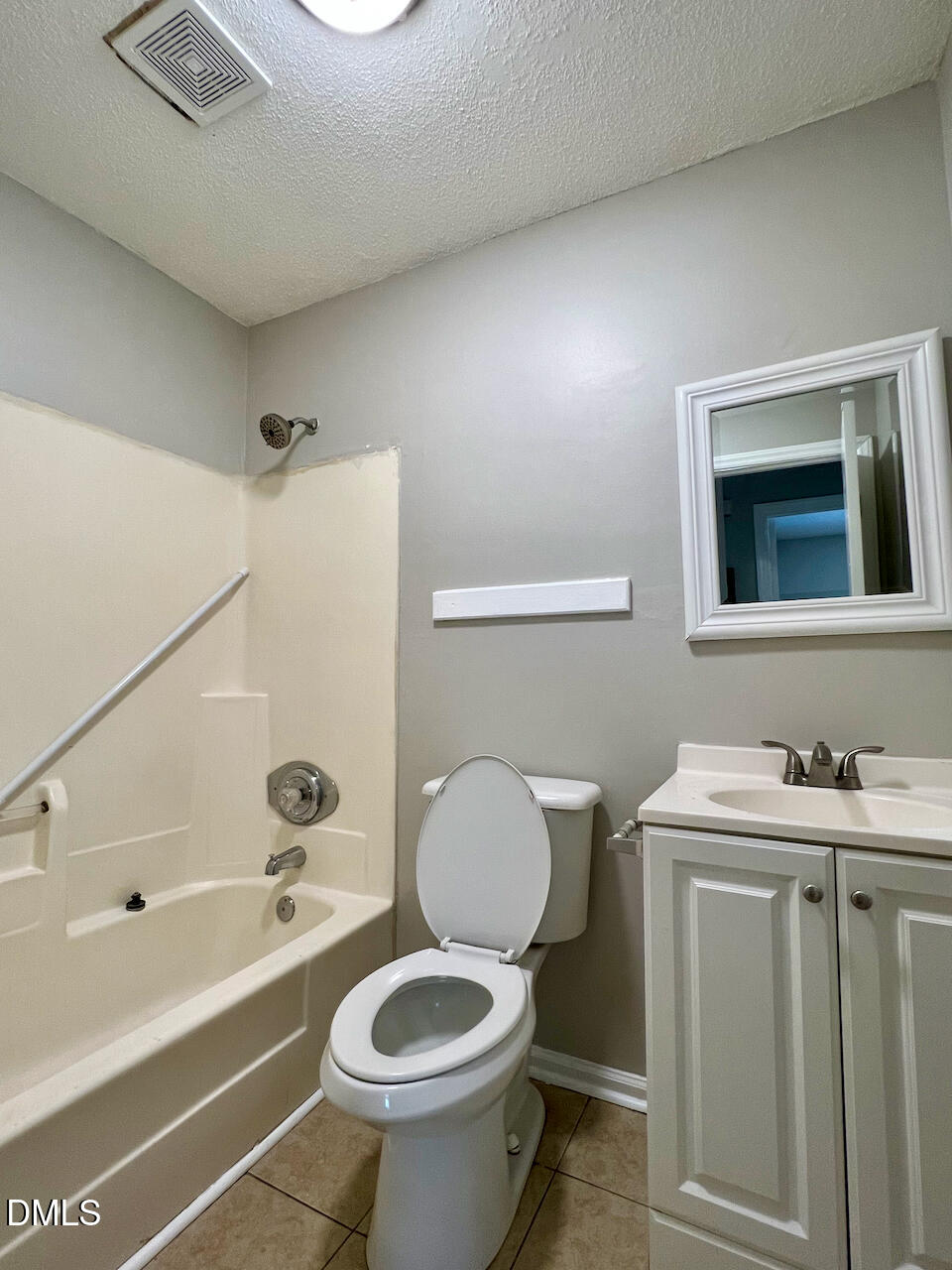 1320 Poole Road, Unit L Raleigh, NC 27610 - Photo 9 of 12 a bathroom with a sink toilet and shower