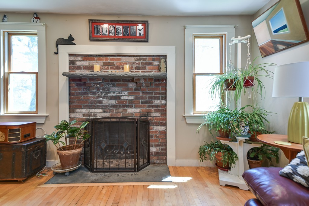 5 Lupine Road Natick, MA 01760 - Photo 12 of 29 a living room with furniture and a fireplace