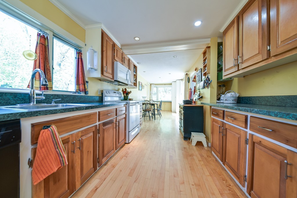 5 Lupine Road Natick, MA 01760 - Photo 17 of 29 a kitchen with stainless steel appliances granite countertop wooden floors and sink