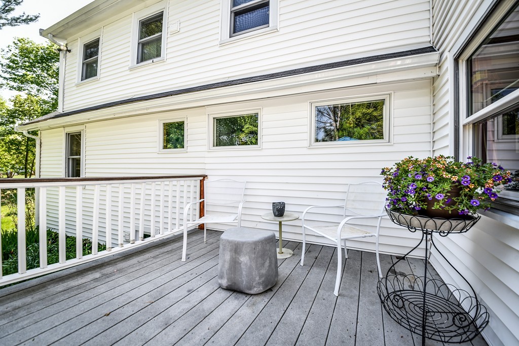 5 Lupine Road Natick, MA 01760 - Photo 26 of 29 a view of a chairs and table on the deck