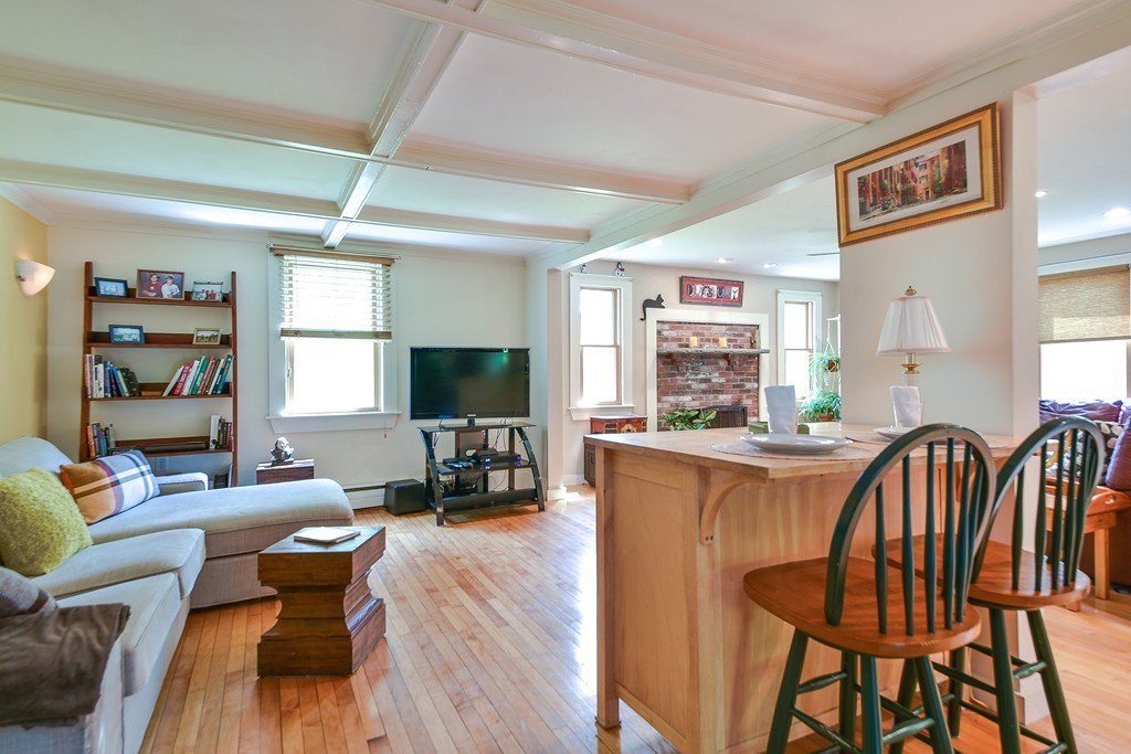 5 Lupine Road Natick, MA 01760 - Photo 7 of 29 a living room with furniture a wooden floor and a large window