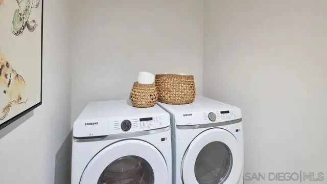 a utility room with dryer and washer