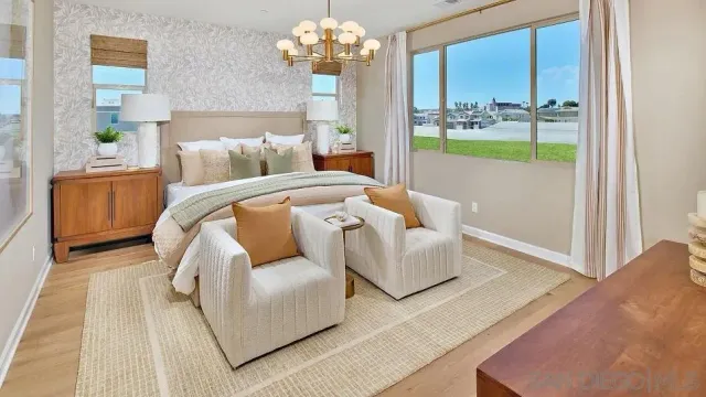 a bedroom with bed and a couch