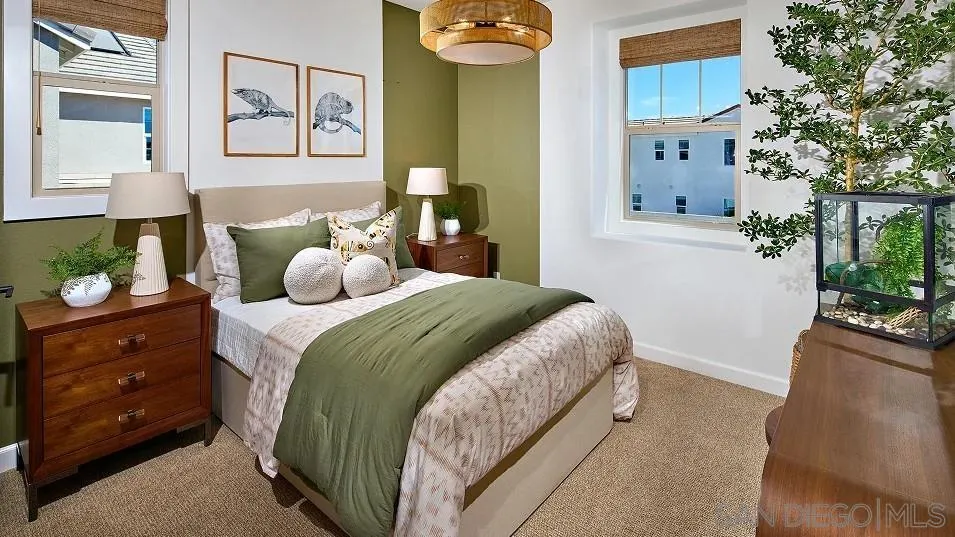 111 Metz Way Oceanside, CA 92057 - Photo 8 of 16 a bedroom with a bed and a potted plant