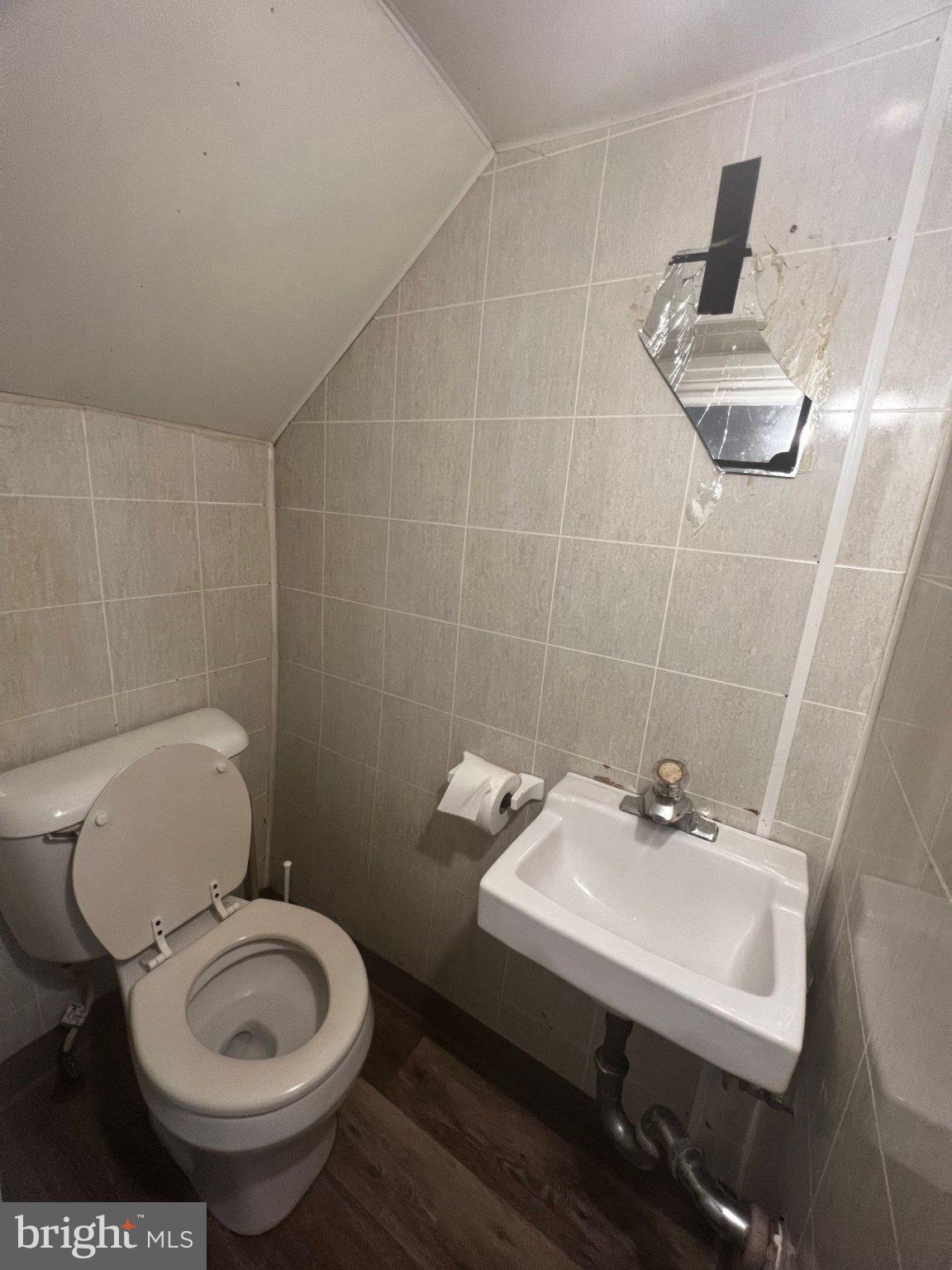 306 West Jackson Street York, PA 17401 - Photo 13 of 15 a bathroom with a sink a toilet and a mirror