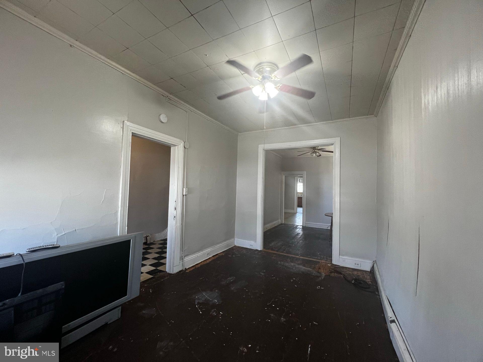 306 West Jackson Street York, PA 17401 - Photo 6 of 15 wooden floor in an empty room with a mirror