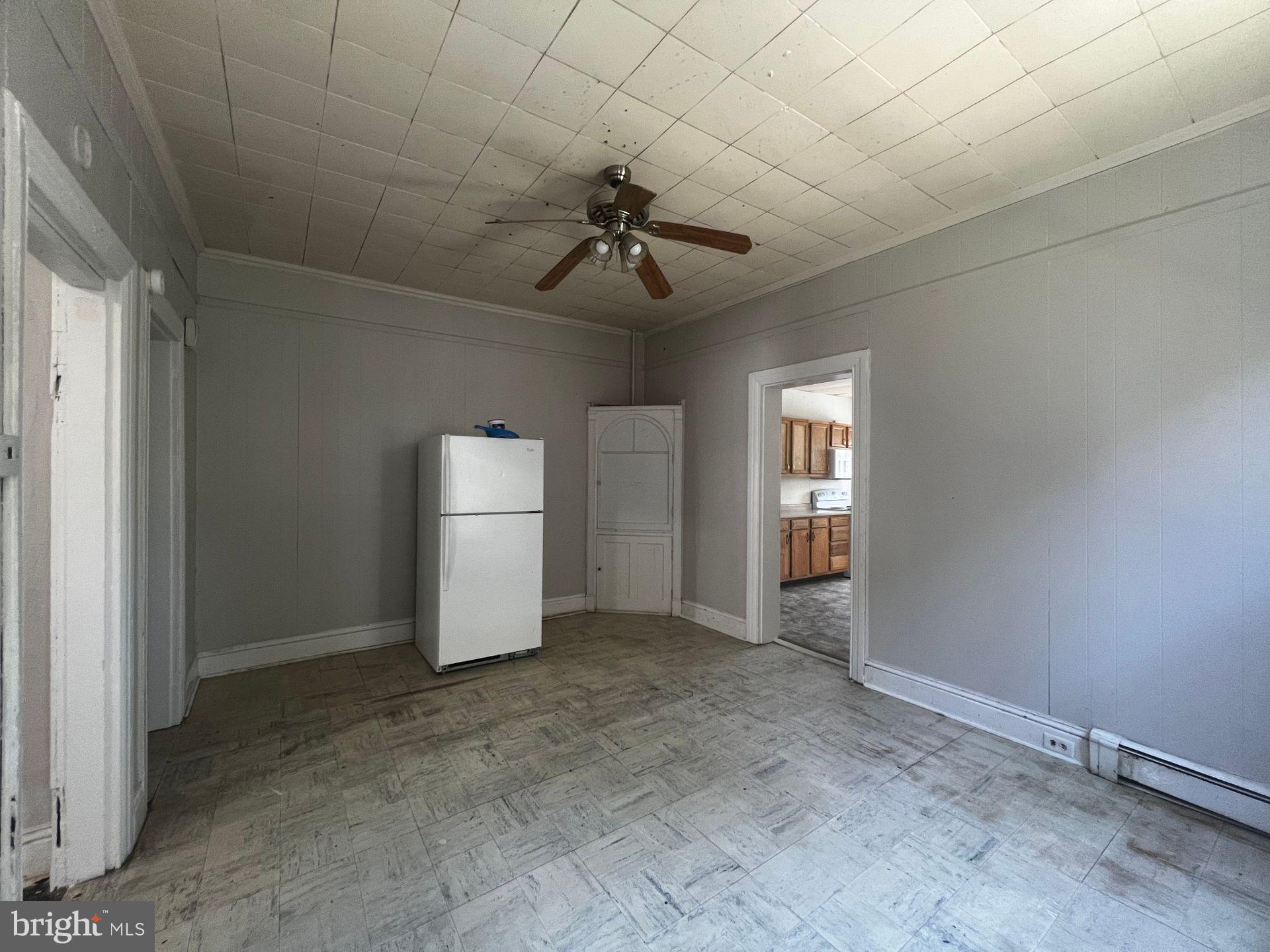 306 West Jackson Street York, PA 17401 - Photo 7 of 15 an empty room with chandelier fan and windows